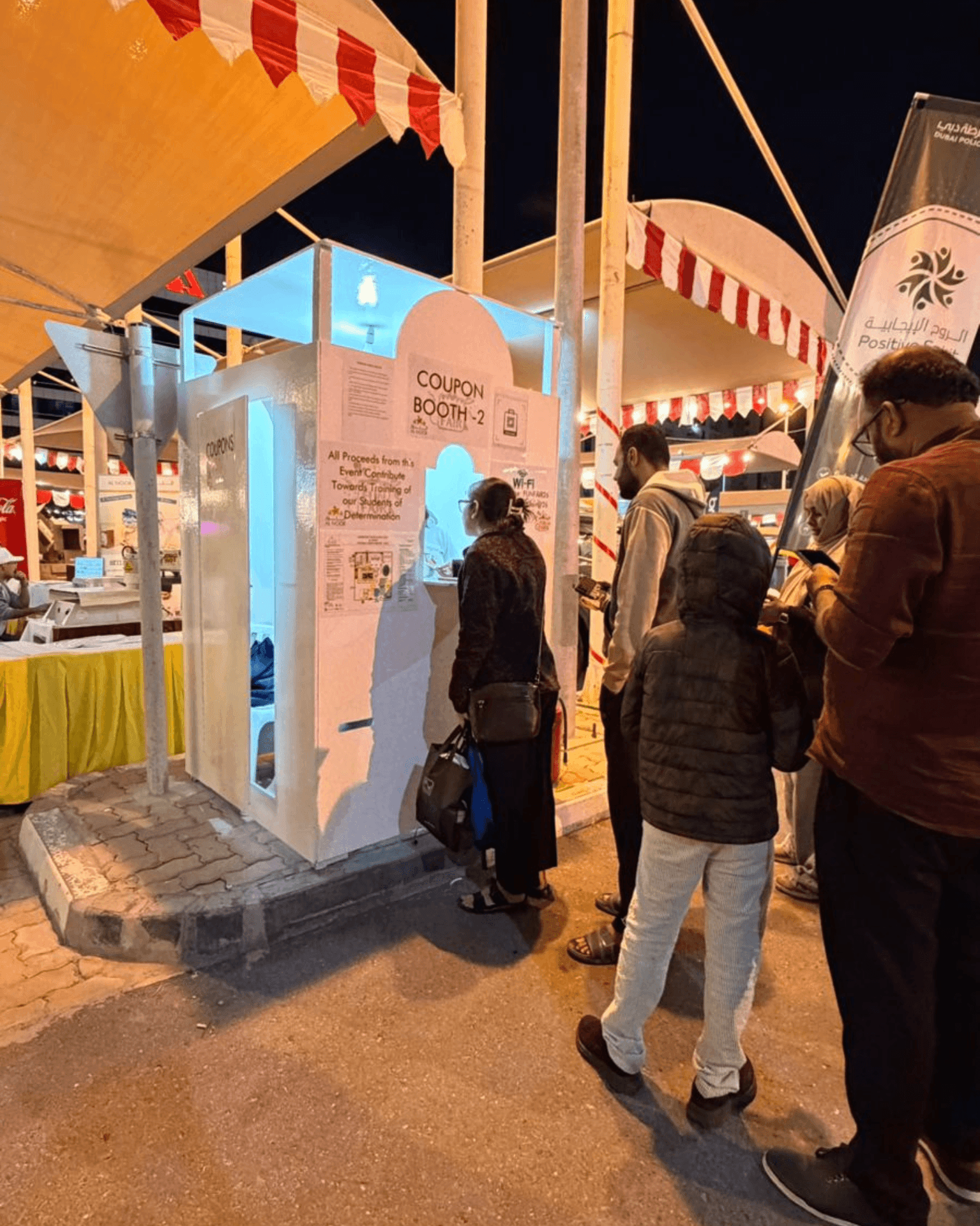 Visitors checking in at registration and processing wallet top-ups